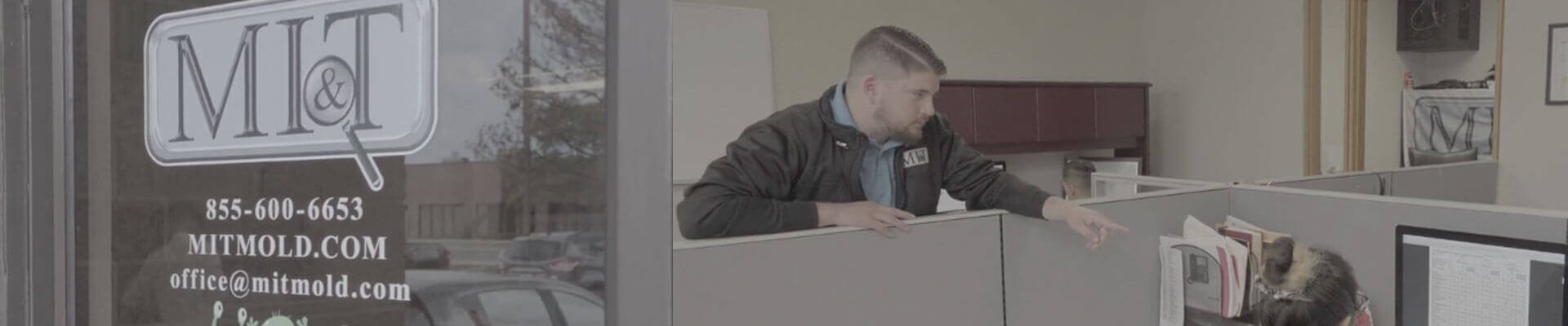 MI&T Mold Inspection & Testing office with employee